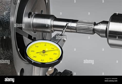 Close-up of an A&P mechanic using a micrometer on an aircraft part