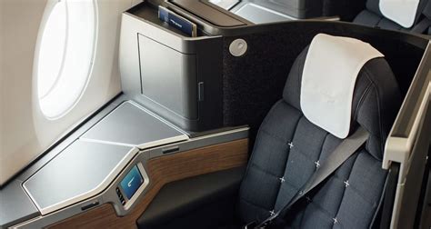 Close-up of Club World Suite seat with personal controls and storage compartments