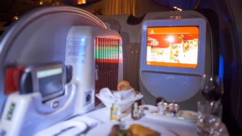 Close-up of Emirates ICE in-flight entertainment screen with movie selection
