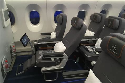 close-up of premium economy seat on Lufthansa A350 with footrest and large screen