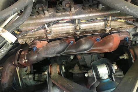 close-up of safety wire on high-temperature exhaust manifold bolts