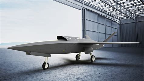 Close-up of XQ-58A Valkyrie payload bay showcasing modular weapon integration on static display