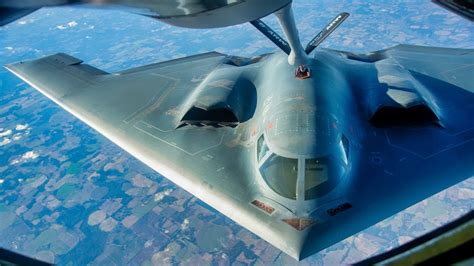 close-up view of b-2 stealth bomber with visible airframe contours and refueling port