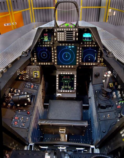 cockpit interior of f-22 raptor with multi function displays and stealth controls