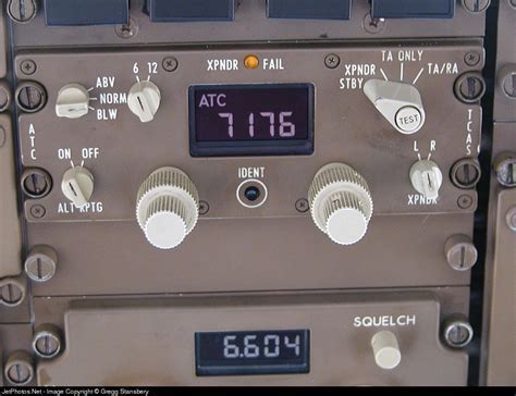 cockpit view of pilot declaring emergency with squawk 7700 on transponder panel