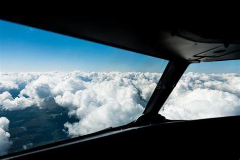 cockpit view of pilot flying toward marginal weather horizon with low ceiling clouds