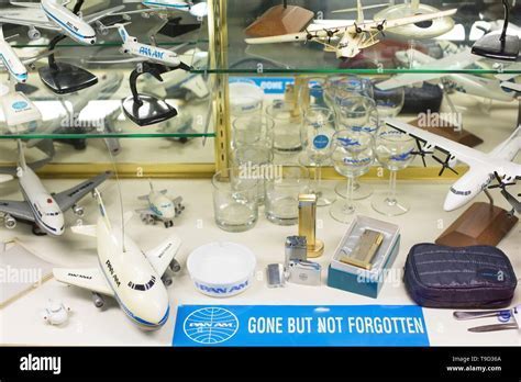 Collection of Pan Am memorabilia including logos, model planes, and advertisements