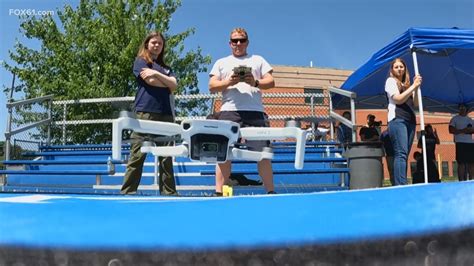 college students flying training drones at Norwalk Community College field