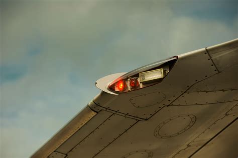 commercial aircraft anti-collision beacon glowing at night