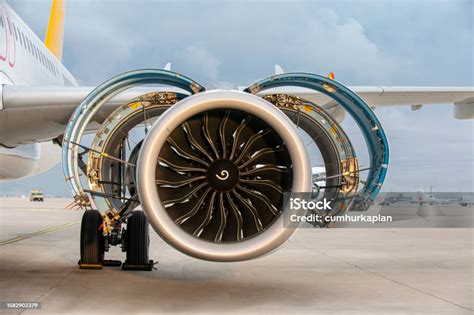 commercial aircraft parked awaiting engine maintenance and repairs
