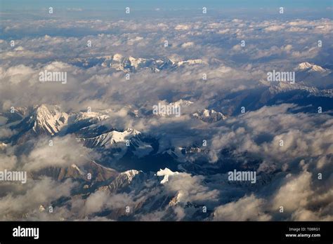 commercial airliner flying above the Himalayas under jet stream conditions