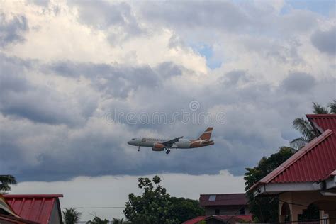 Commercial jet climbing over residential neighborhoods during departure