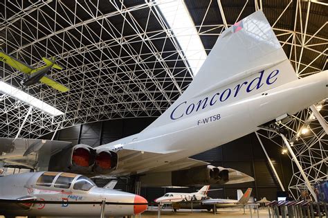 Concorde preserved in museum hangar with visitors