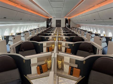 corporate travelers seated in international business class cabin