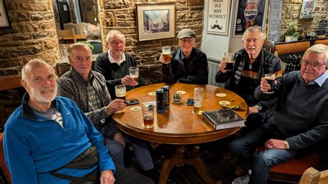 cosy Tenby pub with live music and locals enjoying pints of ale
