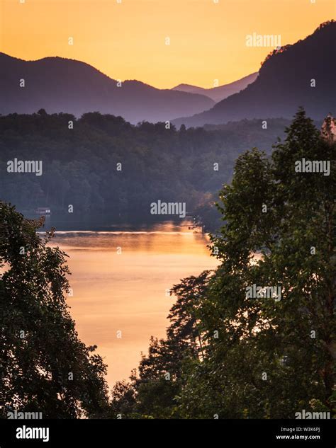 Couple enjoying Scenic Helicopter ride during sunset over Lake Lure, North Carolina