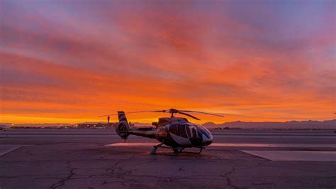 couple enjoying sunset helicopter tour over minneapolis and saint paul
