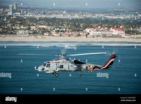 couple in helicopter over San Diego during sunset engagement flight