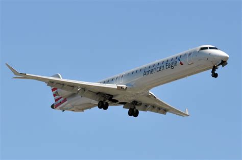 CRJ900 operated by Delta Connection taxiing at a major U.S. hub