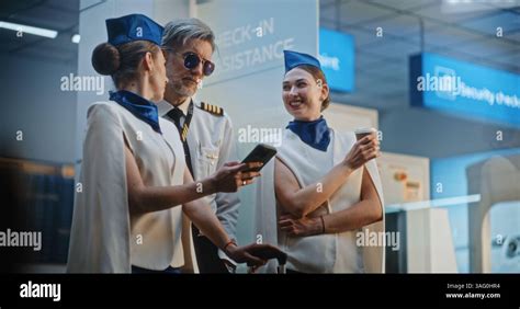 crowded airline cabin with passengers using smartphones