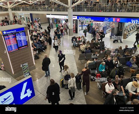 crowded airport lounge capacity control queue outside entrance