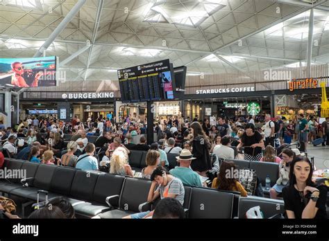 crowded departure terminal during European summer flight disruption