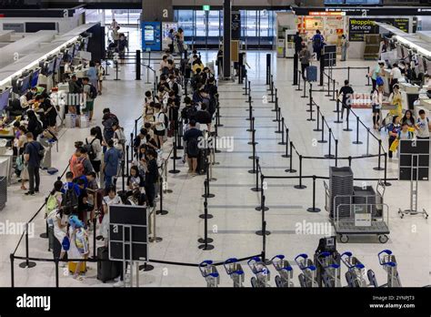 crowded modern airport terminal security checkpoint long queues passengers stress TSA lanes