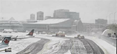 crowded terminal interior at Toronto Pearson during delays