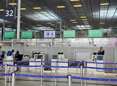 Crowded Transavia check-in line at Paris Orly Airport before departure