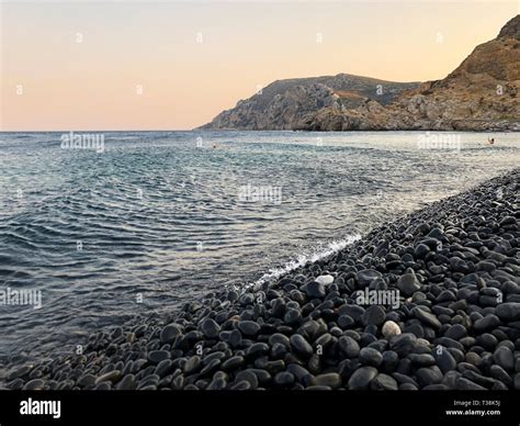 crystal clear waters and volcanic pebbles at Mavra Volia Beach in southern Chios