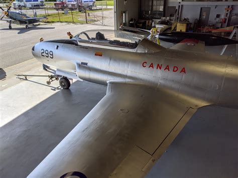 CT-133 Silver Star in vintage RCAF livery flying low over airfield