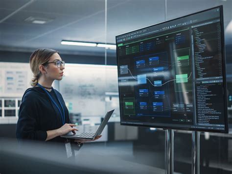 cybersecurity analysts monitoring defense aerospace network operations center