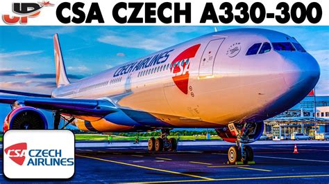 Czech Airlines aircraft and Air Canada A330 on tarmac in Prague with terminal in background