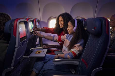 delta air lines 4k QLED seatback screen with anime and YouTube content