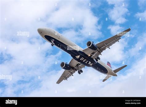 delta air lines a321 departure from mco under sunset sky