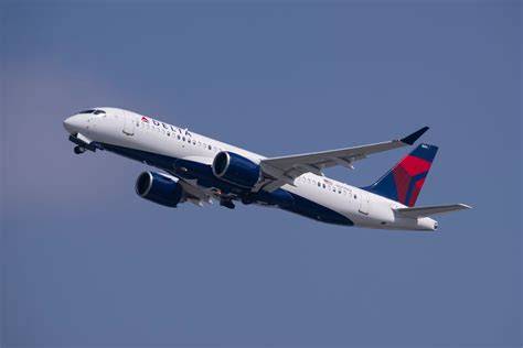 Delta Air Lines Airbus A220 aircraft taking off from airport runway