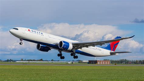 Delta Air Lines Airbus A330 departing New York JFK at sunset