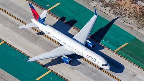 Delta Air Lines Boeing 757-200 climbing steeply, showing thrust from RB211-535E4 engines