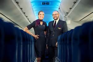 Delta Air Lines cabin passengers using laptops inflight