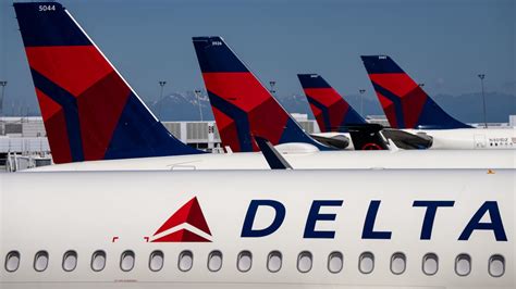 Delta Air Lines college football charter flight signage at the gate