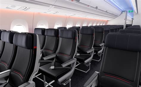 delta air lines economy class interior with passengers boarding an international flight