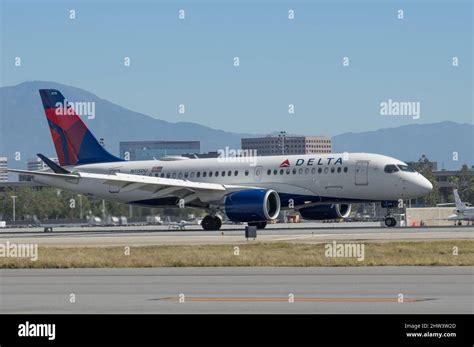 delta airbus a220-300 taxiing at austin with sustainability livery