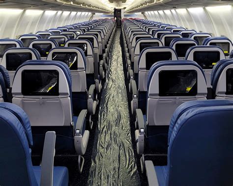 Delta Airlines Boeing 737-800 lined up for departure with pilot in cockpit