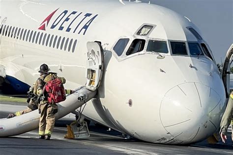 delta airlines cockpit crew preparing post-landing reports JFK