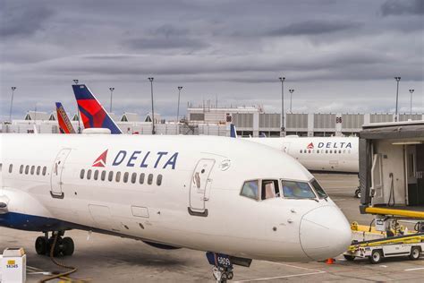 delta boeing 757-200 parked at cecil airport emergency response vehicles nearby