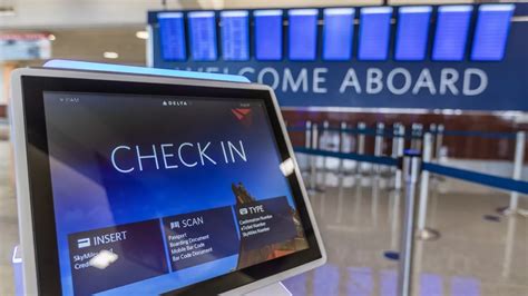 Delta check-in counters at Los Angeles International Airport with international destinations display
