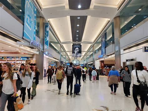delta flight at miami international airport with ces promotional signage