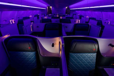 delta one suite cabin with ambient lighting and privacy doors closed
