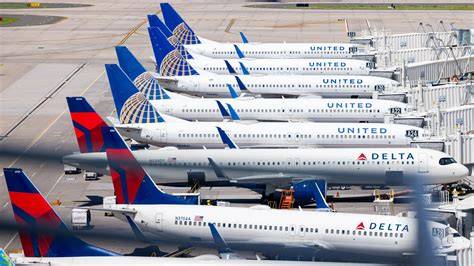 Delta United American Airlines aircraft lineup at major US airport hub