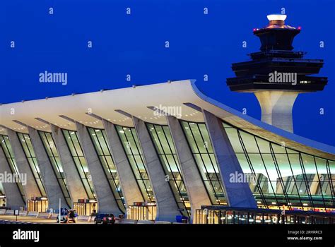 Denver International Airport main terminal with distinctive white roof and surrounding runways